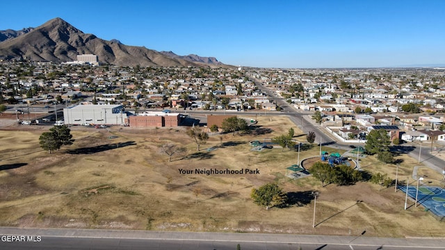 drone / aerial view with a residential view and a mountain view