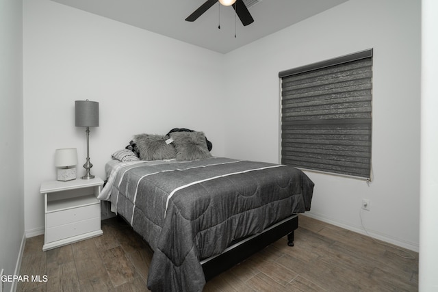 bedroom with wood finished floors, baseboards, and a ceiling fan