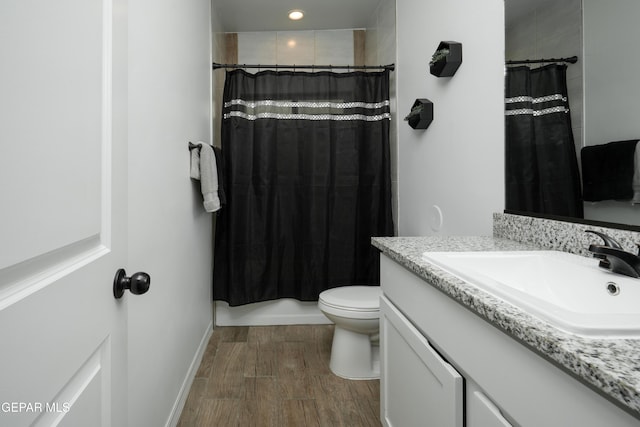 full bath with a shower with shower curtain, toilet, recessed lighting, vanity, and wood finished floors