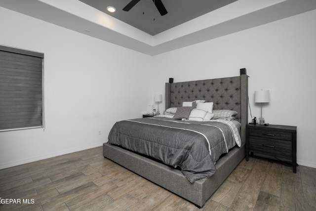 bedroom with recessed lighting, ceiling fan, baseboards, and wood finished floors