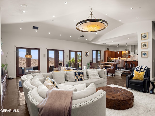 living area with high vaulted ceiling, baseboards, and recessed lighting