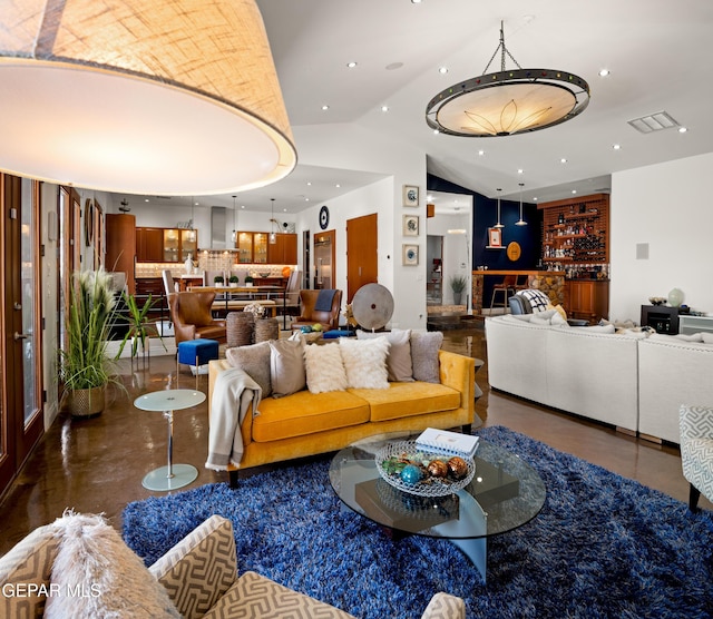 living area featuring visible vents, recessed lighting, and lofted ceiling