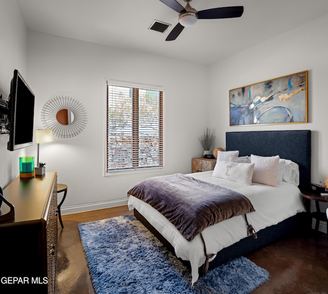 bedroom featuring baseboards, ceiling fan, and visible vents