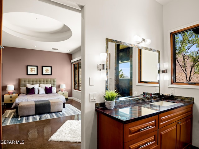 bedroom with a sink and visible vents