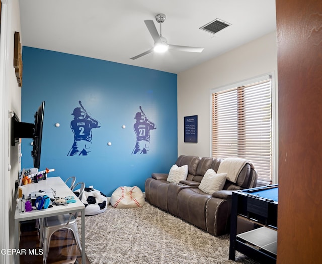 interior space with visible vents and a ceiling fan