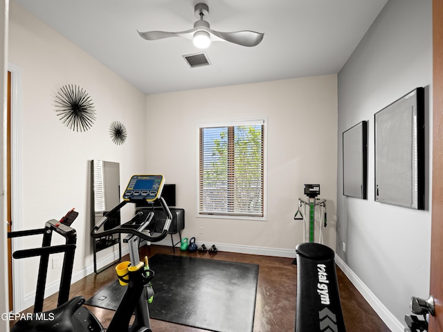 workout room featuring baseboards, visible vents, and ceiling fan