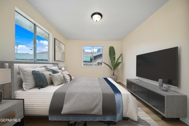3217 Aurora Ave, El Paso, TX 79930 - bedroom featuring wood finished floors