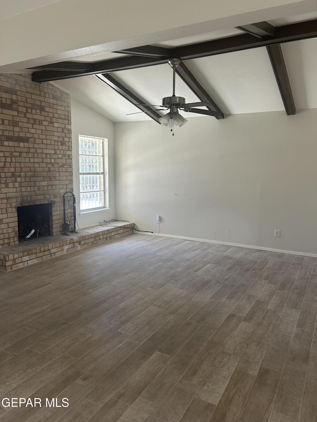 2816 Gaston Dr, El Paso, TX 79935 - unfurnished living room with a ceiling fan, a brick fireplace, dark wood finished floors, and baseboards