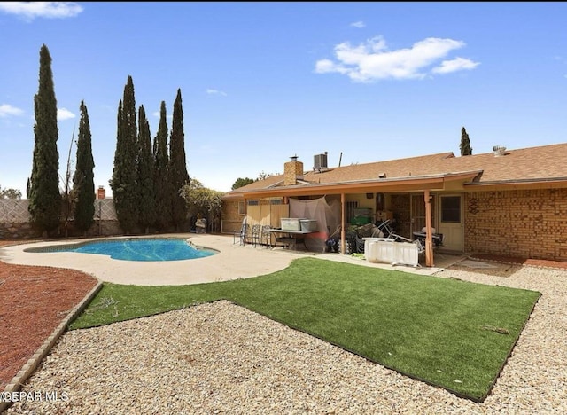 2816 Gaston Dr, El Paso, TX 79935 - view of swimming pool featuring a patio area, a fenced backyard, and central air condition unit