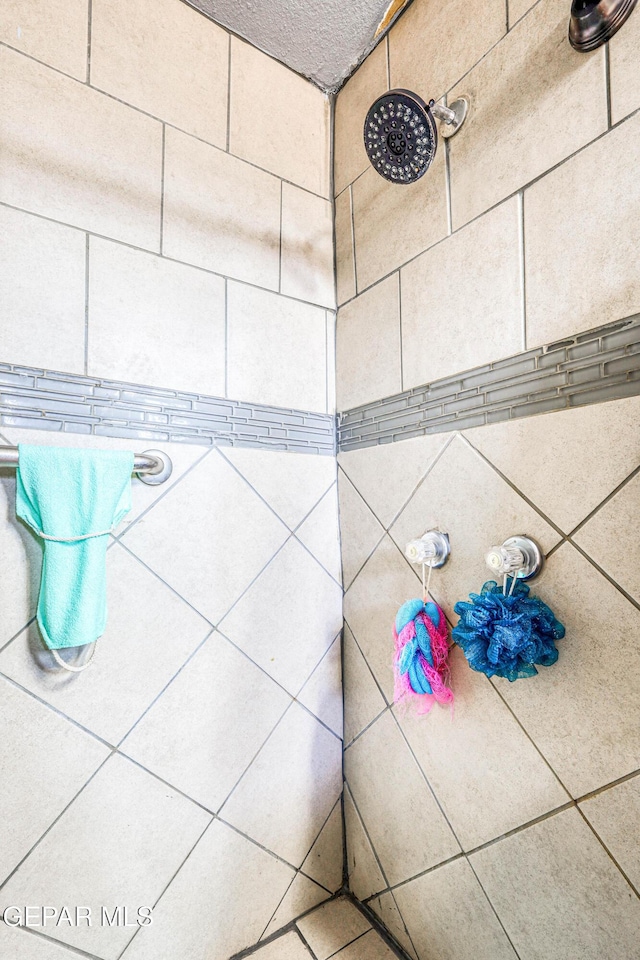 room details with a tile shower