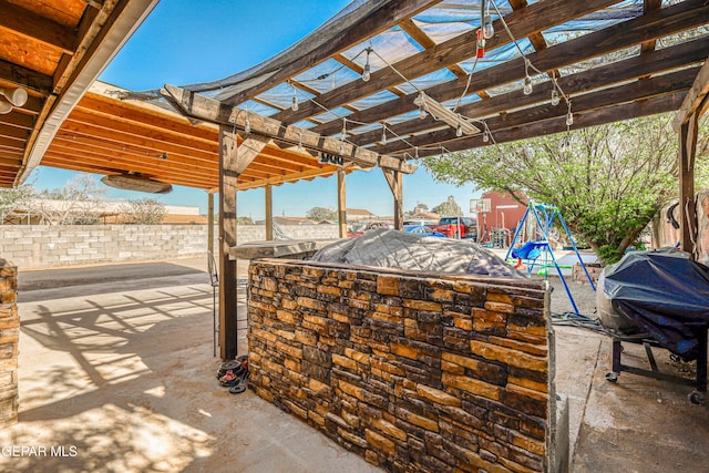 view of patio / terrace with a pergola, outdoor dry bar, and area for grilling