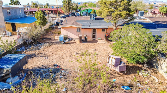 back of house with fence and a patio