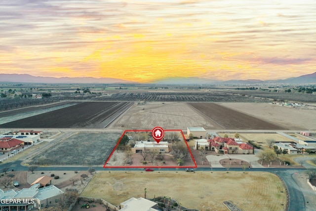 32 Cielo Dorado Dr, Anthony, NM 88021 - aerial view at dusk featuring a mountain view