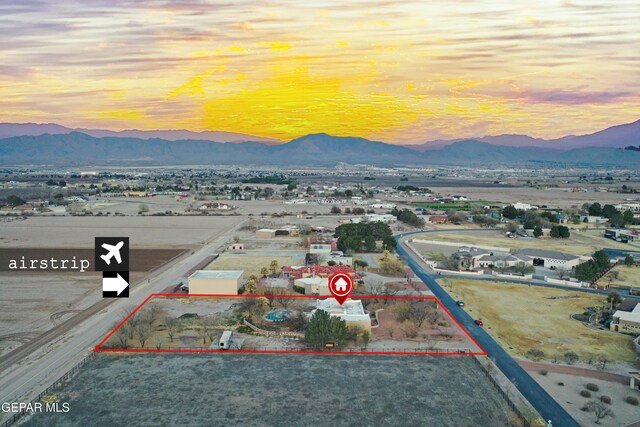 32 Cielo Dorado Dr, Anthony, NM 88021 - aerial view at dusk with a mountain view