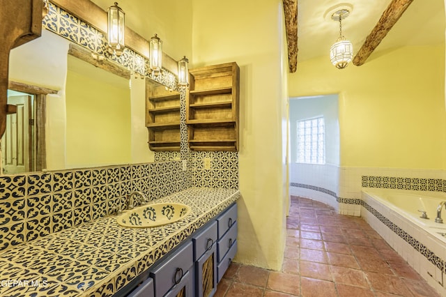 32 Cielo Dorado Dr, Anthony, NM 88021 - full bathroom featuring backsplash, beam ceiling, a relaxing tiled tub, and vanity