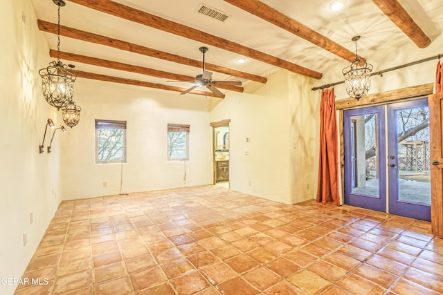 32 Cielo Dorado Dr, Anthony, NM 88021 - spare room featuring visible vents, beamed ceiling, recessed lighting, ceiling fan with notable chandelier, and french doors