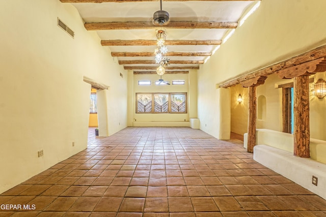 32 Cielo Dorado Dr, Anthony, NM 88021 - interior space with tile patterned flooring, visible vents, a high ceiling, and beam ceiling
