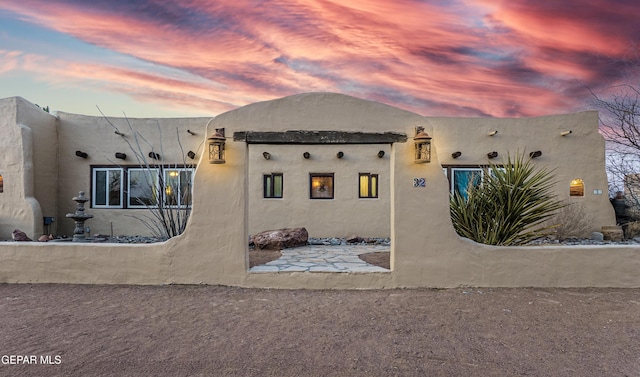 32 Cielo Dorado Dr, Anthony, NM 88021 - view of back of property at dusk