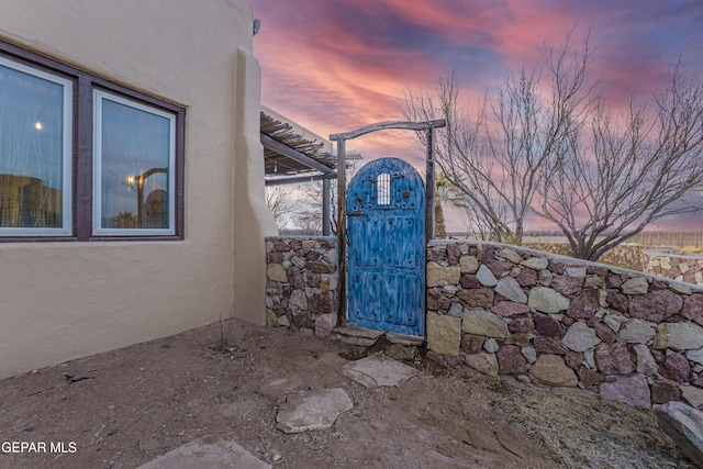 32 Cielo Dorado Dr, Anthony, NM 88021 - property entrance featuring stucco siding