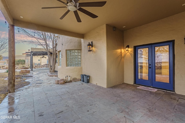 32 Cielo Dorado Dr, Anthony, NM 88021 - patio terrace at dusk with french doors and a ceiling fan