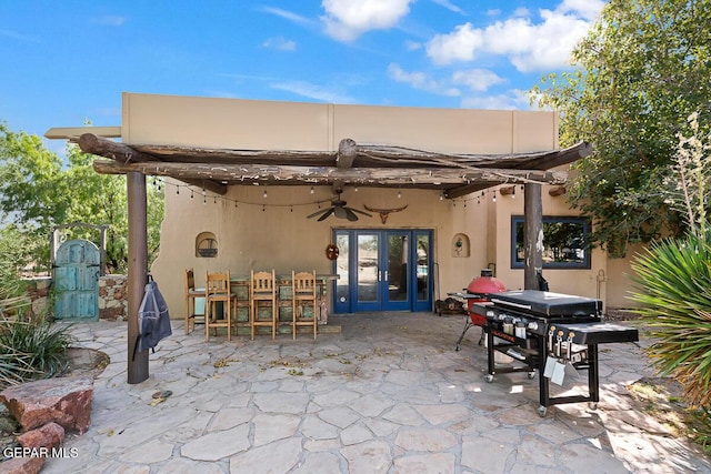 32 Cielo Dorado Dr, Anthony, NM 88021 - view of patio featuring a ceiling fan, area for grilling, french doors, and outdoor dining area