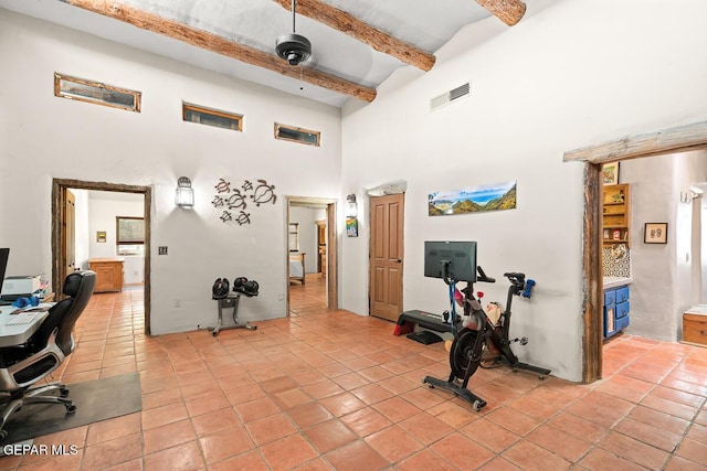 32 Cielo Dorado Dr, Anthony, NM 88021 - interior space with visible vents, a high ceiling, beam ceiling, and light tile patterned flooring
