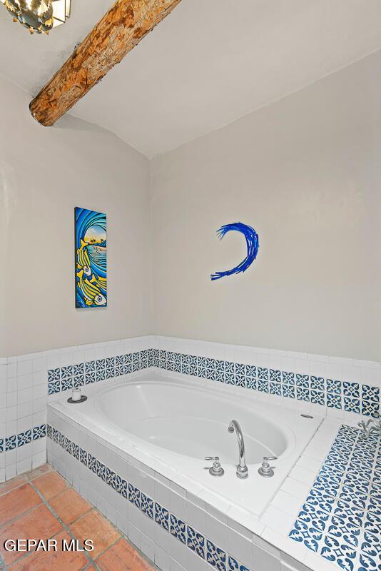 32 Cielo Dorado Dr, Anthony, NM 88021 - full bathroom with tile patterned flooring, a garden tub, and beam ceiling
