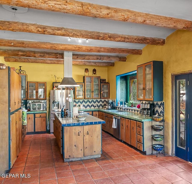 32 Cielo Dorado Dr, Anthony, NM 88021 - kitchen featuring backsplash, a kitchen island, beam ceiling, appliances with stainless steel finishes, and a sink
