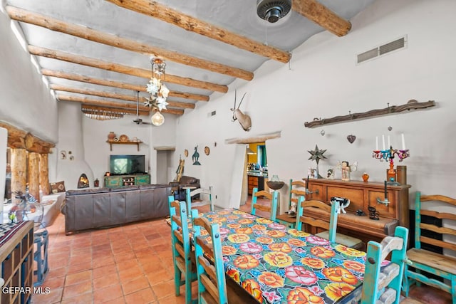 32 Cielo Dorado Dr, Anthony, NM 88021 - dining room with beam ceiling, a towering ceiling, light tile patterned flooring, and visible vents