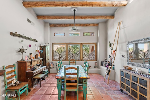 32 Cielo Dorado Dr, Anthony, NM 88021 - dining space with visible vents, a high ceiling, and beam ceiling