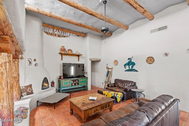 32 Cielo Dorado Dr, Anthony, NM 88021 - tiled living area with visible vents, a ceiling fan, and lofted ceiling with beams