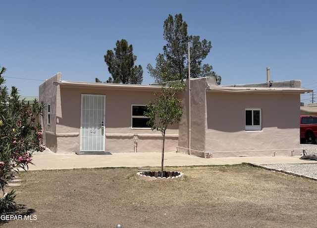 222 Lone Star Pl, El Paso, TX 79907 - rear view of house featuring stucco siding