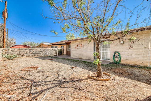 exterior space with fence and a patio