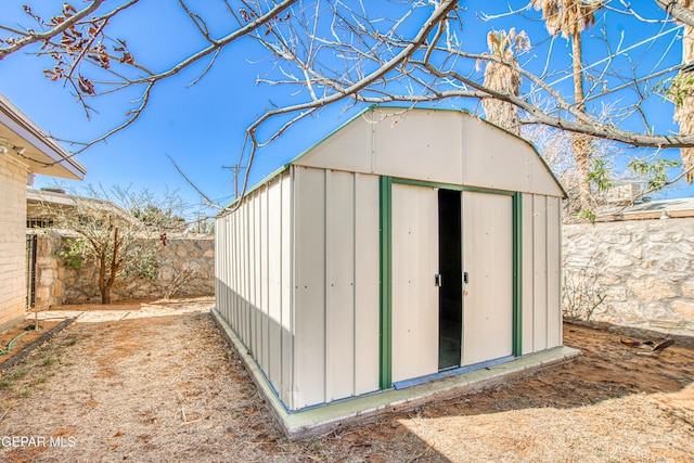 view of shed with a fenced backyard