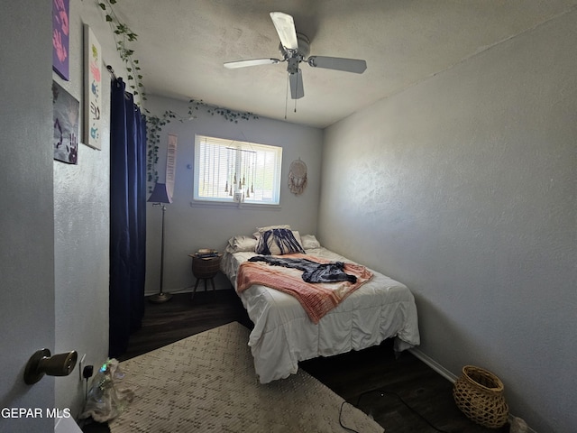 bedroom with ceiling fan and wood finished floors