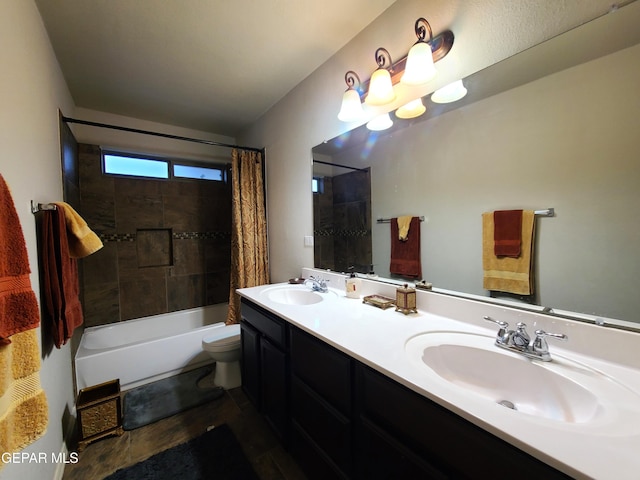full bath with double vanity, toilet, a sink, and shower / bath combo