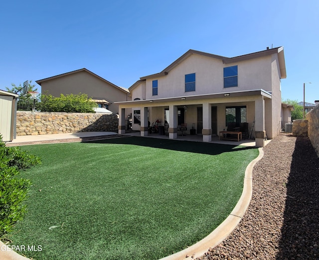 back of property featuring a patio, a fenced backyard, stucco siding, and an outdoor hangout area