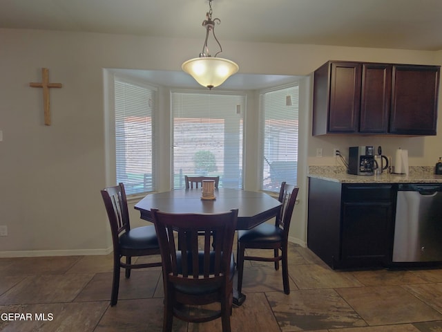 dining space featuring baseboards