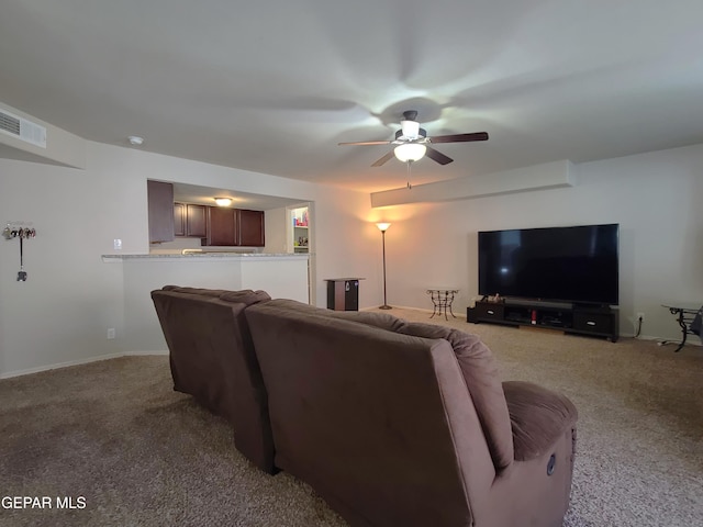 carpeted living room with ceiling fan, visible vents, and baseboards
