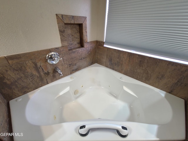 bathroom featuring a jetted tub