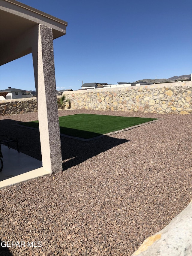 fenced backyard featuring a patio