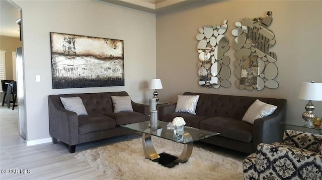 living room featuring baseboards