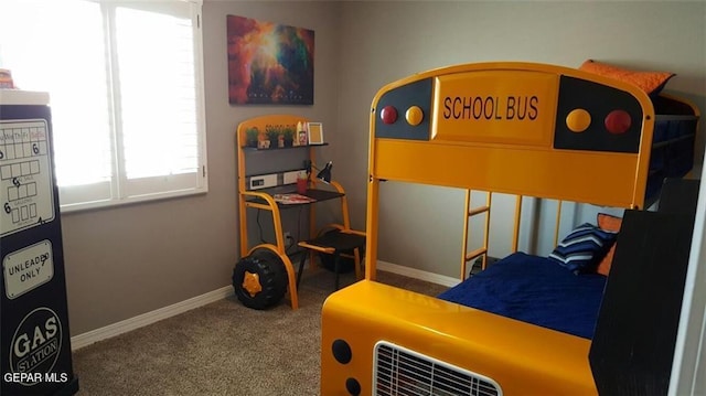 bedroom with carpet flooring and baseboards