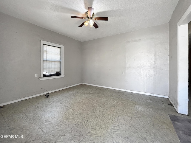 81 N Eucalyptus St, El Paso, TX 79901 - empty room featuring tile patterned floors, ceiling fan, baseboards, and a textured ceiling