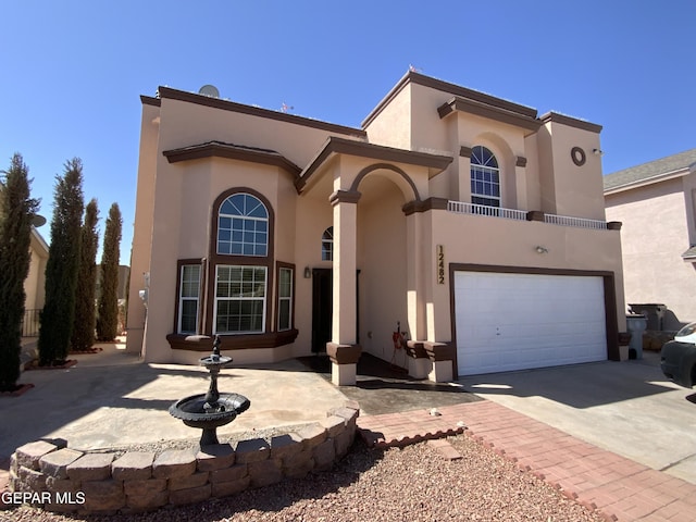 12482 Paseo Rojo Dr, El Paso, TX 79928 - view of front of house featuring driveway, a garage, and stucco siding