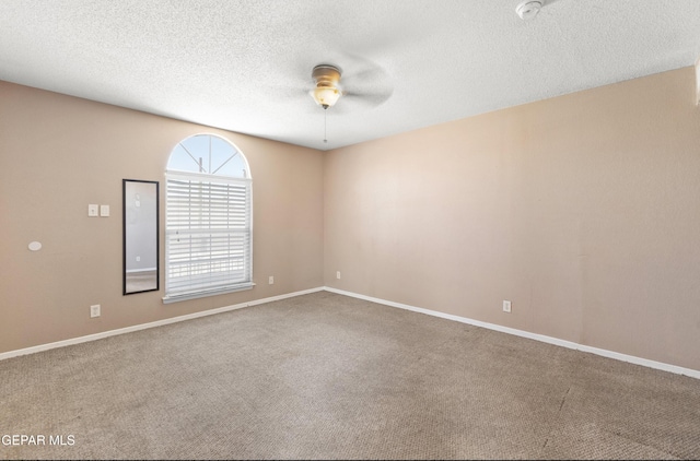 12482 Paseo Rojo Dr, El Paso, TX 79928 - carpeted spare room with baseboards, a textured ceiling, and a ceiling fan