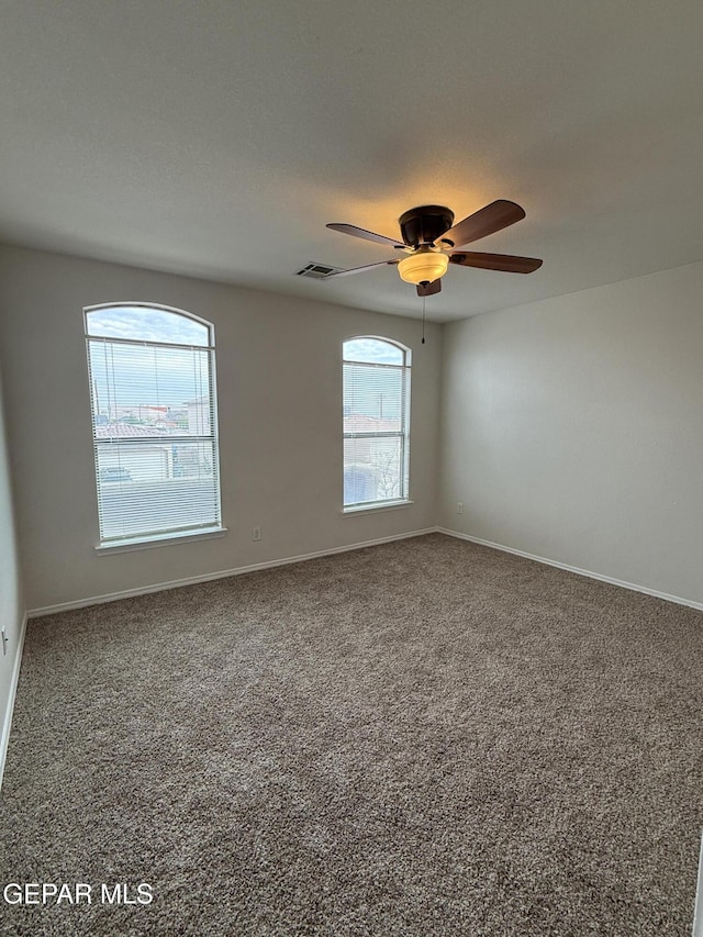 14368 N Cave Dr, El Paso, TX 79938 - carpeted spare room with visible vents, baseboards, and a ceiling fan