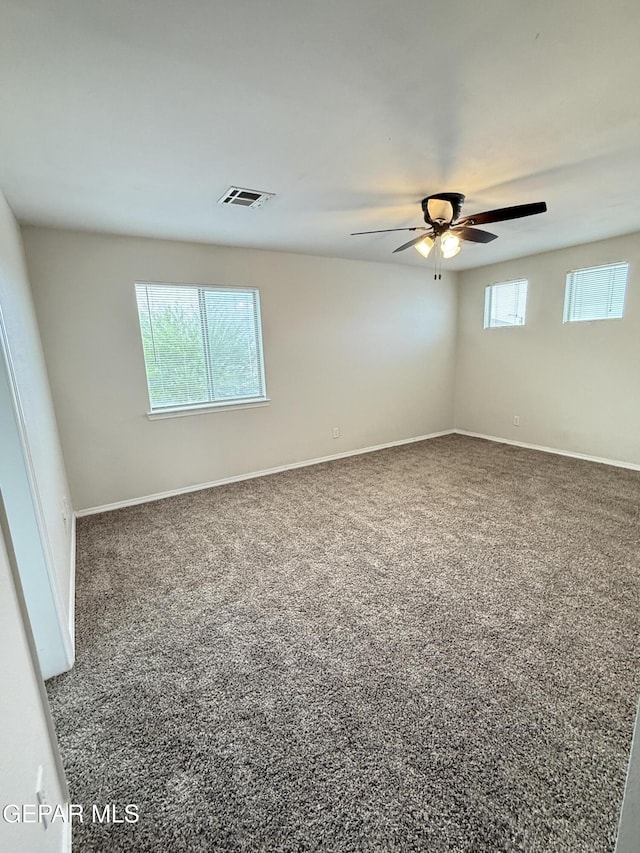 14368 N Cave Dr, El Paso, TX 79938 - unfurnished room with carpet, visible vents, ceiling fan, and a healthy amount of sunlight