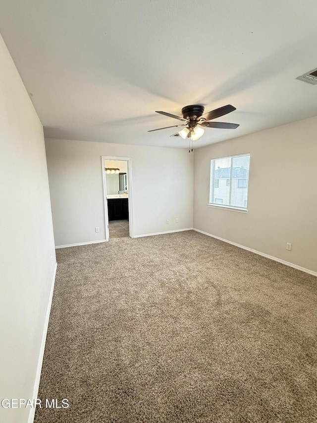 14368 N Cave Dr, El Paso, TX 79938 - spare room featuring visible vents, ceiling fan, carpet, and baseboards