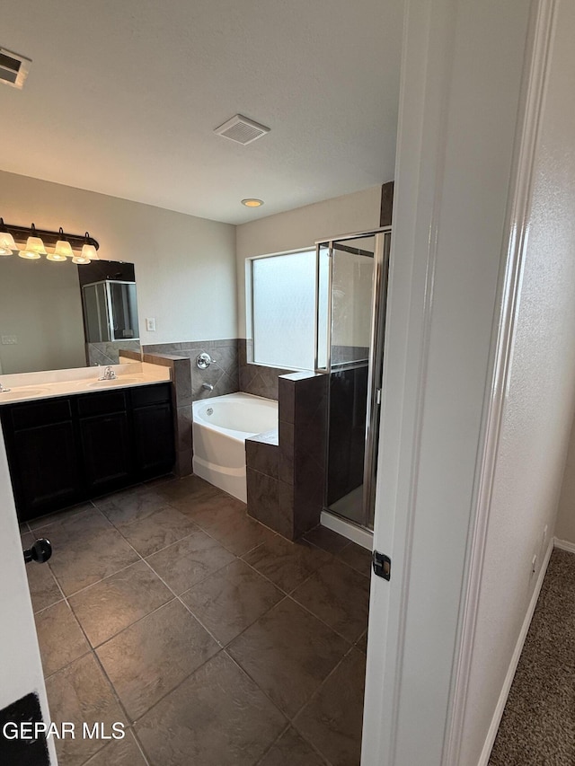 14368 N Cave Dr, El Paso, TX 79938 - full bath featuring a stall shower, a garden tub, vanity, and visible vents
